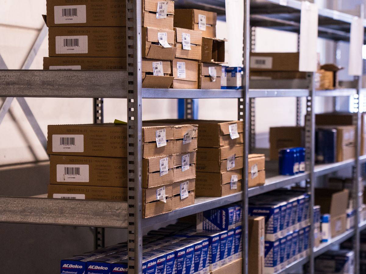 Shelves with small parts in boxes
